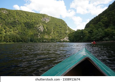 View Over the Bow of a Kayak in the Delaware Water Gap Between Pennsylvania and New Jersey