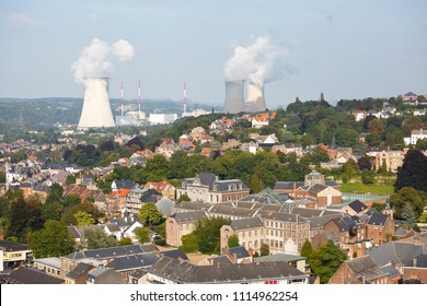 View over the city of Huy in Belgium at Meuse River to the distant nuclear power station of Tihange. - Shutterstock ID 1114962254