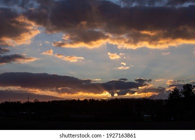 View Over Countryside At Sunset, Treetops Und Dramatic Cloudy Sky