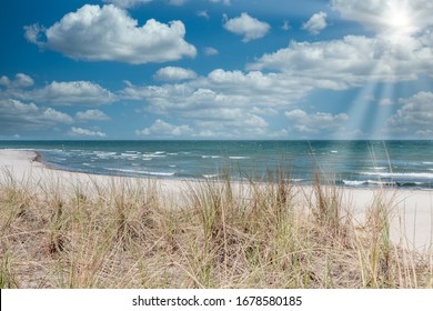 The View Over The Dune Of The Baltic Sea In Beautiful Weather With Sunbeams