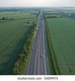 view over the early summer green fields and a dual carriageway road from the air; East Anglia; UK; England