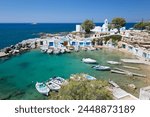 View over fishing harbour with boats and colourful boat houses, Mandrakia, Milos, Cyclades, Aegean Sea, Greek Islands, Greece, Europe