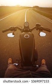 The View Over The Handlebars Of Motorcycle, POV Shot During Ride. Beautiful Sunset , Season Is Here.