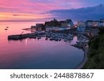 View over harbour and castle at dawn, Tenby, Carmarthen Bay, Pembrokeshire, Wales, United Kingdom, Europe