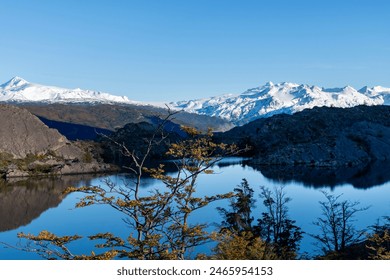 View over Lago Grey (Grey Lake) with perfect reflection of snow covered mountains of the Paine Massif in water along W-trek hiking route in Torres del Paine National Park, Patagonia, Chile - Powered by Shutterstock