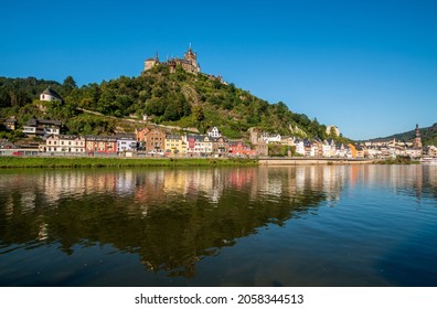 View over the Moselle to Cochem Castle, with reflection in the r
