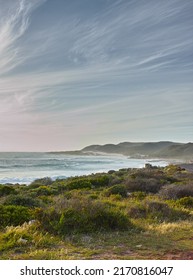 A View Over The Ocean In Cape Province, South Africa. Beauty In Nature With The Seascape Of The Ocean. Sky With Clouds Over The Ocean On A Summers Day. Calm And Serene Nature Scene With Waves