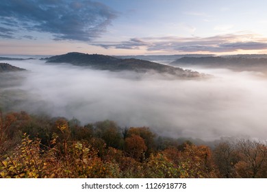 View Over The River Wye From Symonds Yat Rock. Wye Valley Filled With Morning Mist In Autumn.