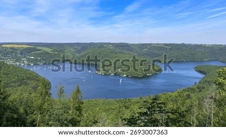 View over the Rur-Lake in the Eifel in Germany - Blue and Green for summer Vacation