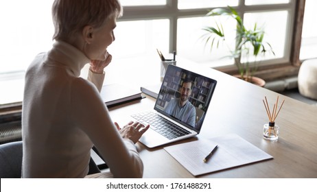 View Over Shoulder Of HR Manager Looking At Laptop Screen Listen Applicant During Distant Online Job Interview. Hiring, Remote Negotiations, Informal Chat With Friend At Workplace, Video Event Concept