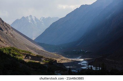 View over the snow covered peak, and mountain ranges, river and valley on the way to  Shandur Pass, Chitral, Khyber Pakhtunkhwa, Pakistan