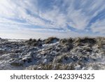 View over the snowy Dunes at the Beach in Norddeich
