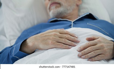 View Of Overworked Wrinkled Hands Of Wise Old Man Peacefully Drowsing In Bed