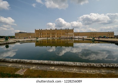 View of the Palace of Versailles in the Reflecting pool in the gardens  - Powered by Shutterstock