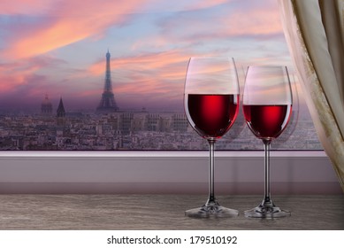 View of Paris and Eiffel tower on sunset from window with two glasses of wine - Shutterstock ID 179510192