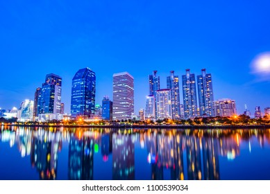 View Of The Park In The Night,Beautiful Reflection Of Skyscrapers On Chao Phraya River Amazing Night Life In Bangkok City,Thailand.