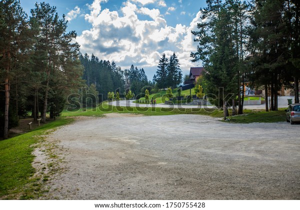 The view of the parking lot at a glamping site\
at Lake Bloke, Nova Vas,\
Slovenia
