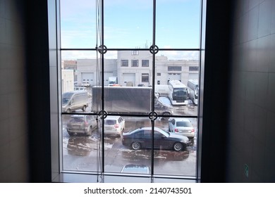 view of the parking lot through the panoramic window of the office
