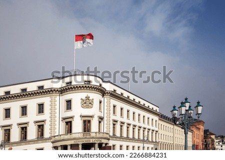 view to parliament of Hesse in Wiesbaden, a former castle, with Hesse Flag at roof top under blue sky Stock photo © 