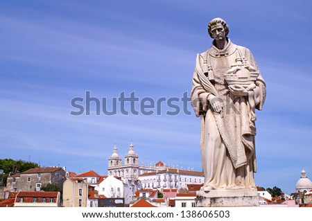 View to a part of Lisbon with a statue in the front