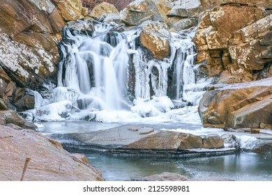 View of partially frozen Scott's Run waterfall. Scott's Run Nature Preserve. Fairfax County. Virginia. USA