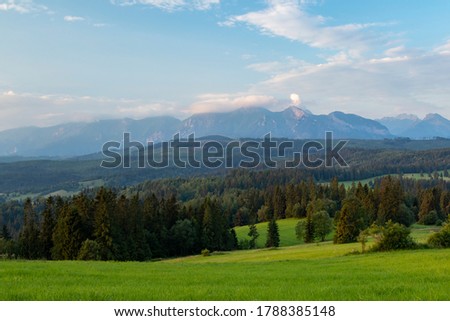 Similar – Image, Stock Photo Inspiring evening light in spring. Sunset in Mountains