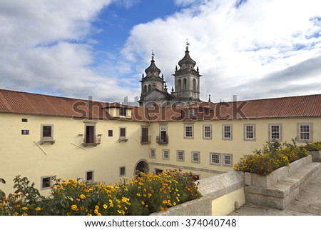 View from the Passageway between the Choristers' quarters and the Lodging House with the church in the background of the Monastery of Sao Martinho in Tibaes, Portugal