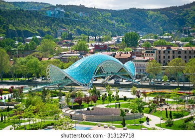 View of Peace Bridge on the River Kura and  European Park. Tbilisi, Georgia