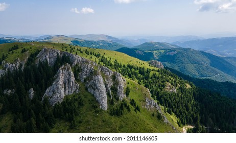 View at a peak and valley in Kopaonik mountains in summer, Serbia. Summer mountains green forest and rock peaks. Travel and vacation concept. - Shutterstock ID 2011146605