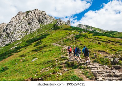 A view of the peaks Small Giewont and Giewont. Majestic mountain landscape in Tatras. Zakopane, Poland. Trekkers discover the world. Active lifestyle, sport and tourism.