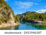 View of the Pend Oreille River and Washington Rock from the Metaline Falls Bridge on State Route 31 in the small Northeastern town of Metaline Falls, Washington.	