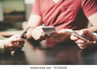 View of people hands using mobile phones