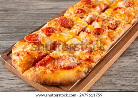 A view of a pepperoni flatbread.