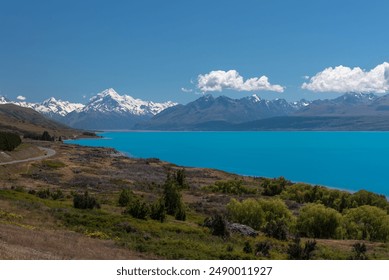 The view from Peters Lookout along the turquoise waters of Lake Pukaki to the snow-capped peak of Mount Cook Aoraki in the Southern Alps. - Powered by Shutterstock