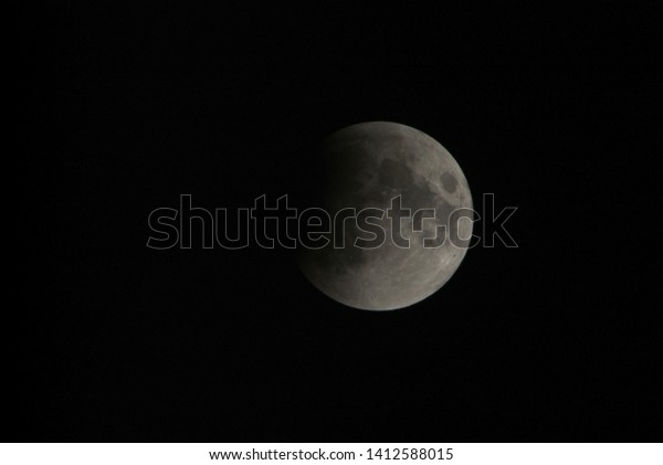 View, of a phase, of the lunar
eclipse through a telephoto lens in Turin, Italy on Feb. 20,
2008.