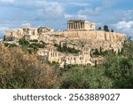 View from Philopappos Hill of the ruins on Acropolis Hill, with Parthenon, Erechtheion, Odeon, Propylaea Gate in view, with Mount Lycabettus behind, in Athens Greece.	