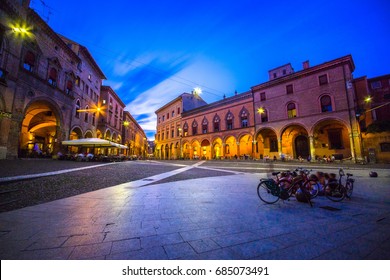 View of the piazza Santo Stefano at the evening with people and bicycles, Bologna, Italy on July 13, 2017.
