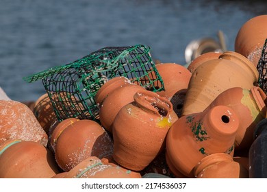 View of a pile of ceramic octopus traps.