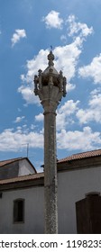 View of the pillory built in early 16th century in Gothic architecture with octagonal column, cage shaped capital, eight cylindrical colonnades, armillary sphere and cross, in Trancoso, Portugal