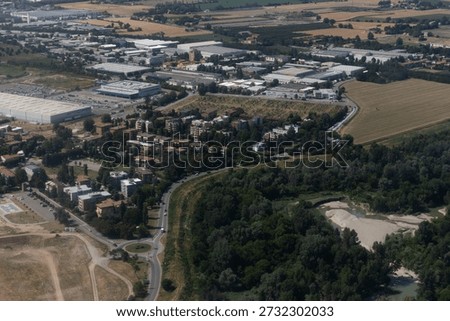 View from the plane of Amazon and Fedex warehouse, Bologna, Italy