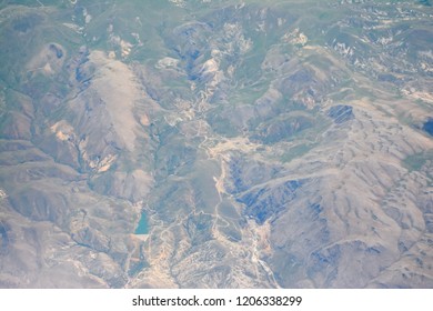 view from the plane to the mountains