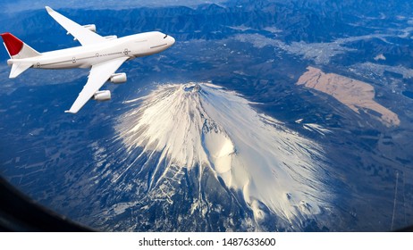 View From The Plane Window,airplane Flying Over Beautiful Natural Landscape View Of Mount Fuji In Winter Season At Japan For Travel Concept.