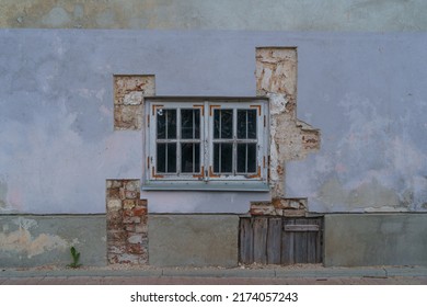 View Of Plastered Wall With Old Wooden Window And Cut Through Plaster To Brickwork Historic Building