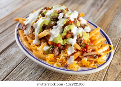 A View Of A Plate Of Carne Asada French Fries.