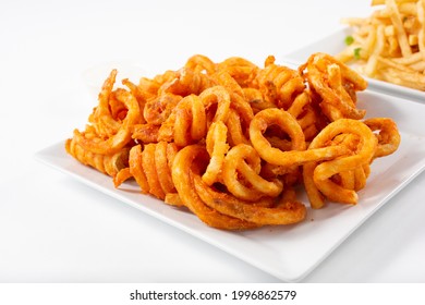 A View Of A Plate Of Curly Fries.