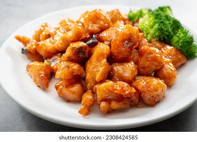 A view of a plate of orange chicken. - Shutterstock ID 2308424585