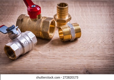 View Plumbing Tools Brass Pipe Connectors On Wooden Board Close Up 