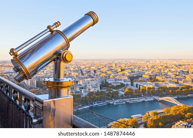 View point with telescope on the Eiffel tower, sunset Paris view