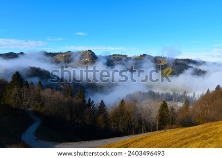 View of Polhograjski Dolomiti misty hills in Gorenjska, Slovenia