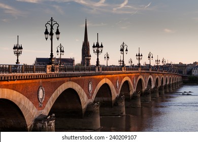 View of the Pont de pierre at sunset in the famous winery region Bordeaux, France